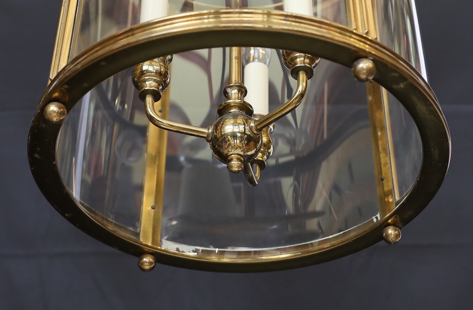 A large Georgian style brass hall lantern with internal bulb holder, height 79cm. diameter 38 cm